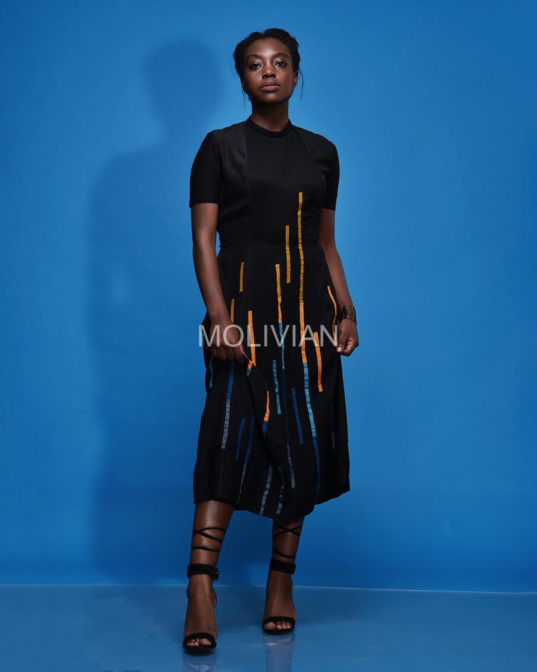 Black flared dress. Versatile as both official and casual wear.